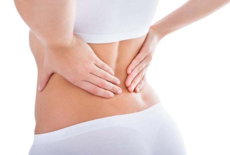 Đau lưng dưới là tình trạng đau, khó chịu vùng thắt lưng